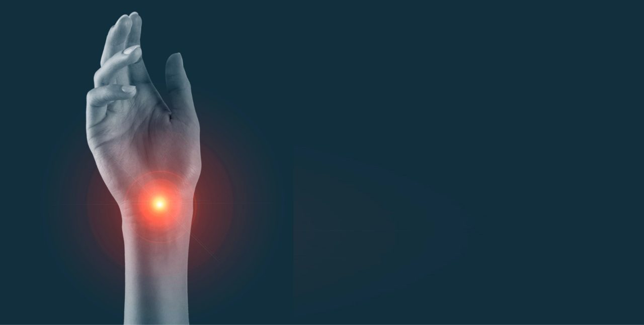 Hand with a glowing red point of pain at the wrist